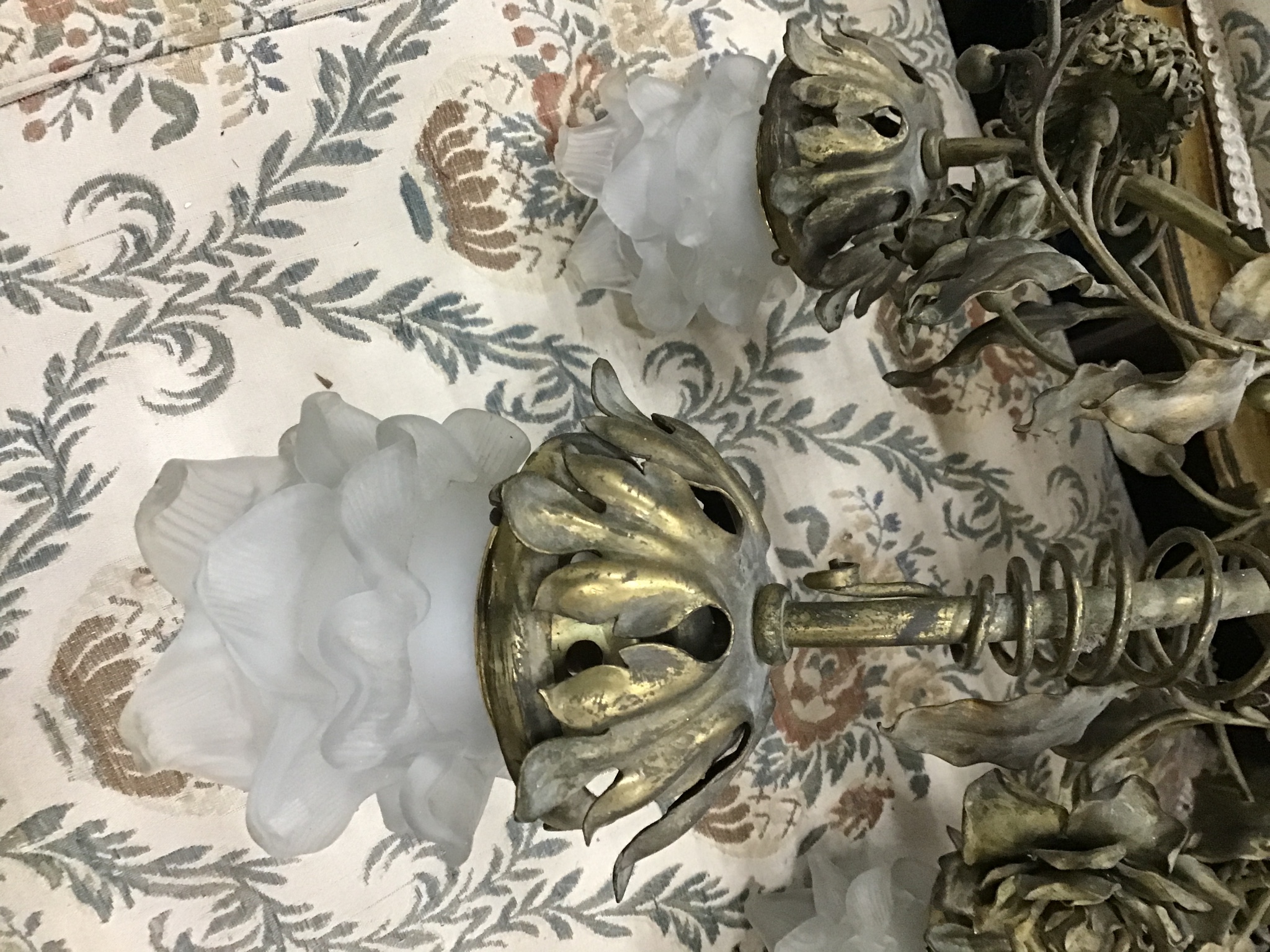 An early 20th century French brass three branch ceiling light with opaque glass shades, height 68cm